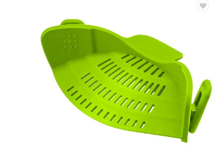 green silicone oven mitt with textured surface on a white background